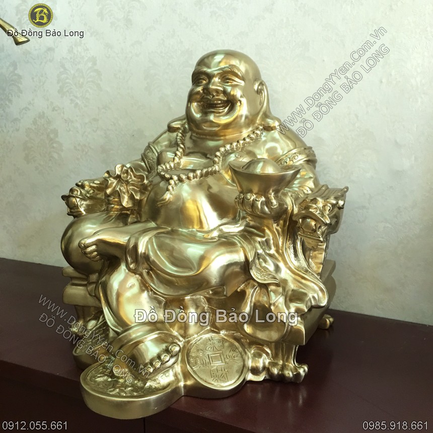 tượng di lặc cầm vàng và bao tiền miệng luôn cười hiền hậu